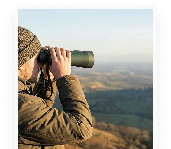 Vision - Person with binoculars looking at landscape